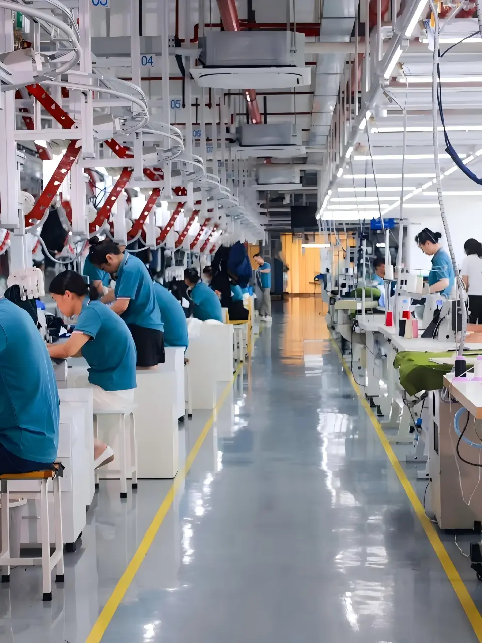 EZ Fishing Wear production team working at sewing stations in Dongguan
