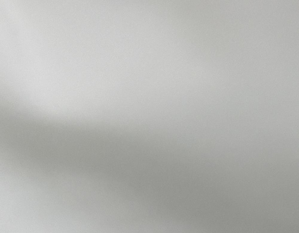 Close-up of white 170 GSM performance knit fabric made from 92 percent polyester and 8 percent spandex