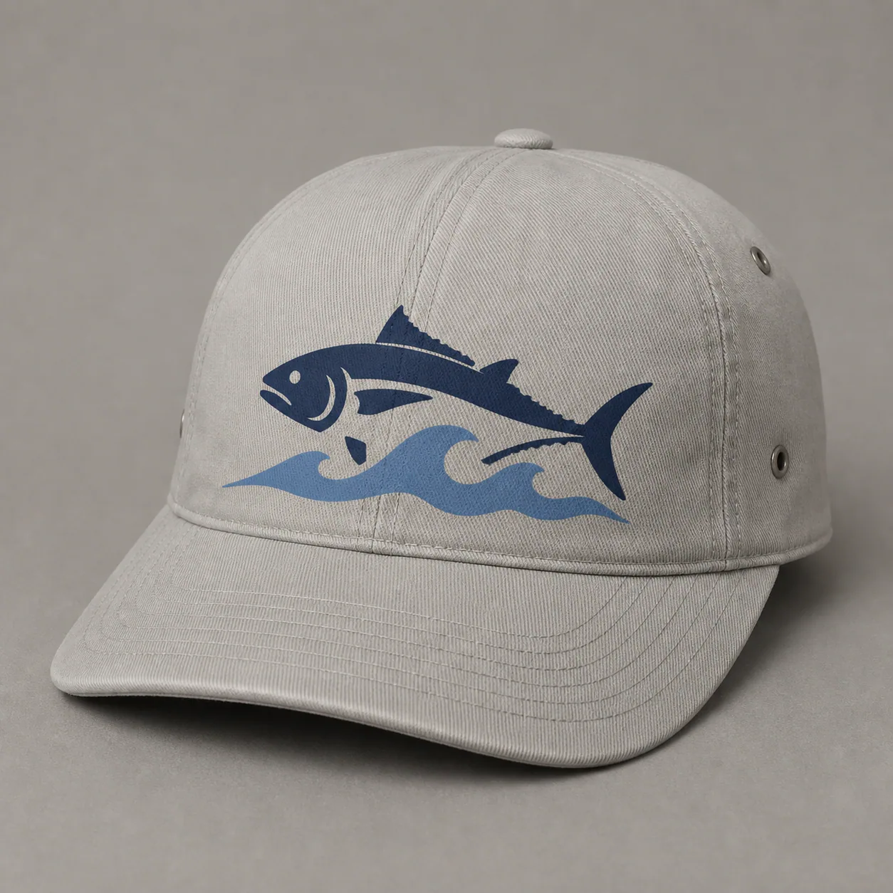 Light gray fishing cap with a flat two-color screen-printed fish and wave graphic