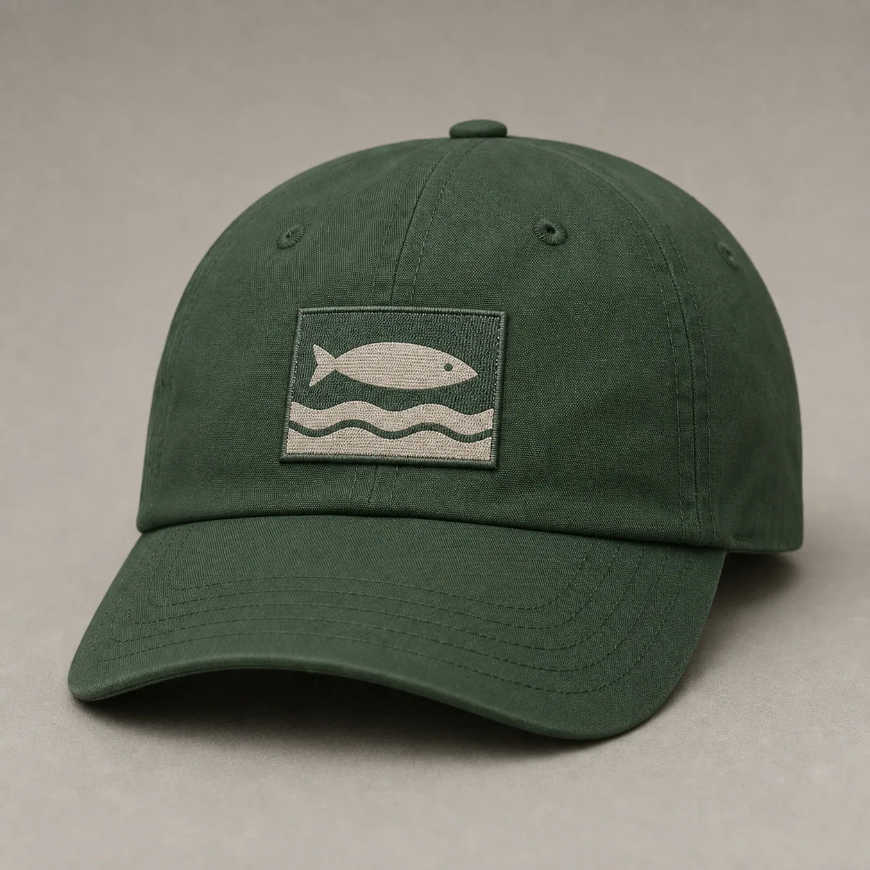 Fishing cap with a rectangular woven fish and wave patch