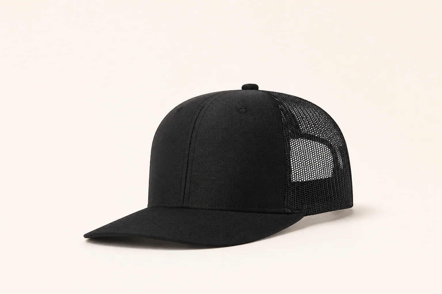 Plain black curved-brim trucker cap with breathable mesh back panels