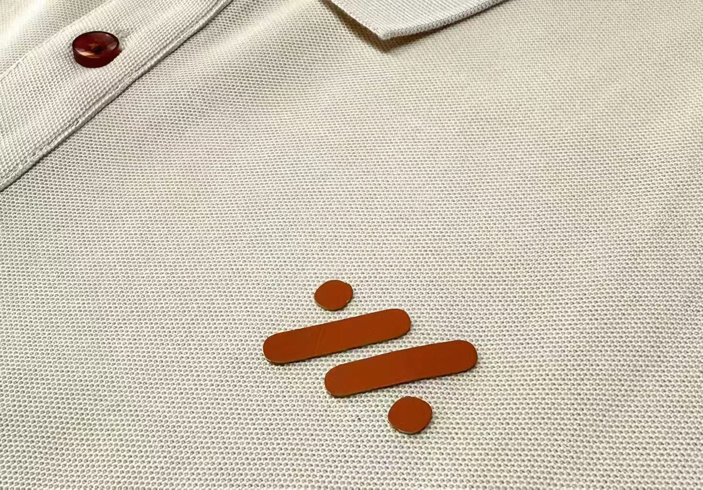 Raised silicone heat-transfer logo on a custom work polo shirt